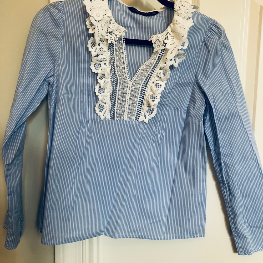 Women’s shirt with darling lace detail.